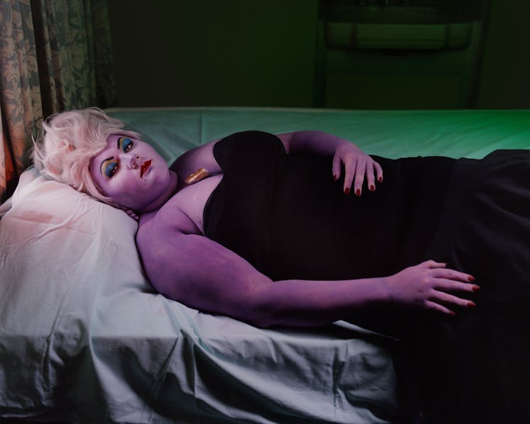 A woman lying on the road in a Ursula cosplay costume by photographer Thurstan Redding