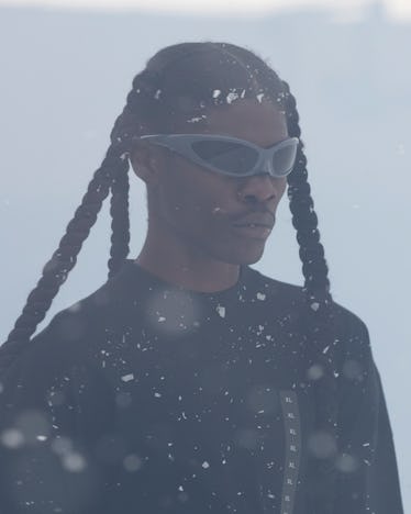 model with braids and sunglasses at balenciaga paris fashion week show