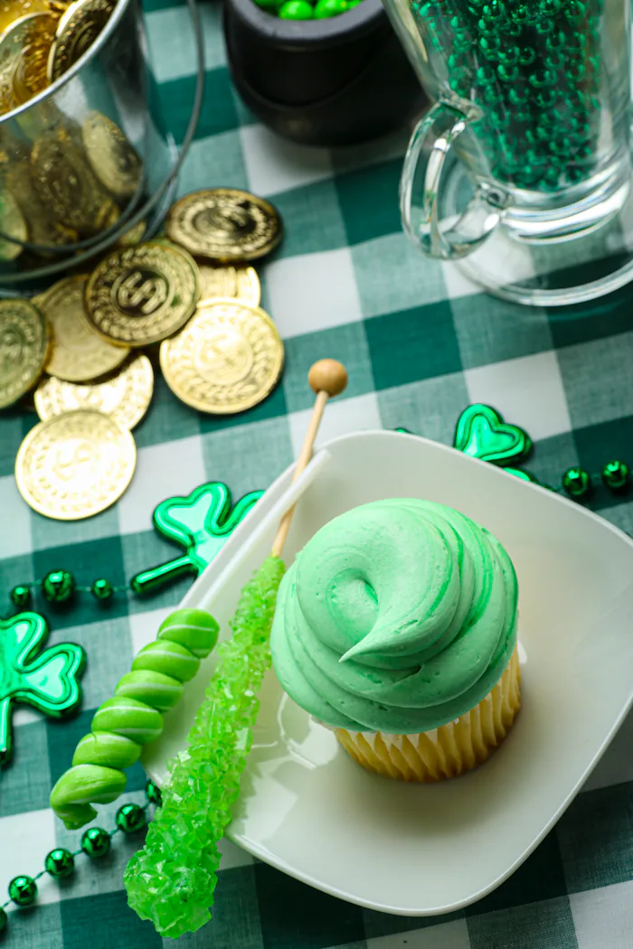 Saint Patrick's Day party ideas, cupcake on a plate with green rock candy and shamrock decor