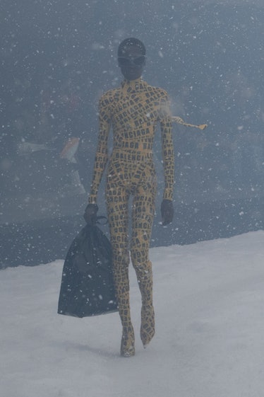 a model wears yellow caution tape by Balenciaga at the paris fashion week show