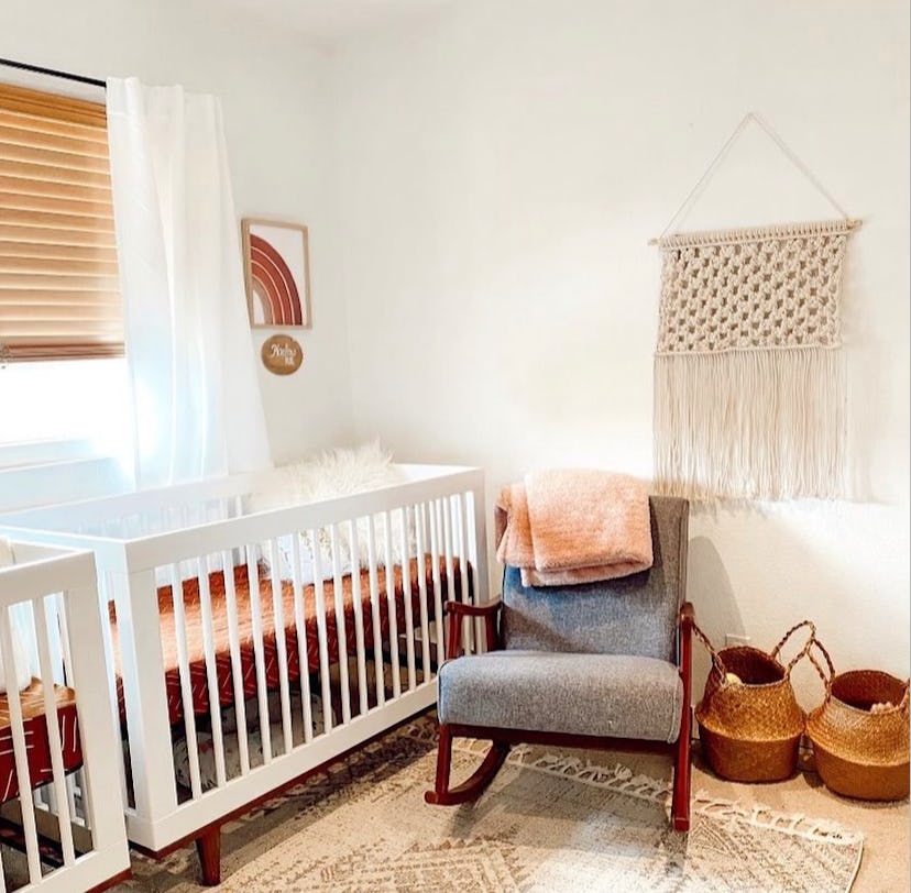 neutral twin nursery with rainbow prints