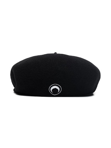 Marine Serre black beret worn with slit skirt