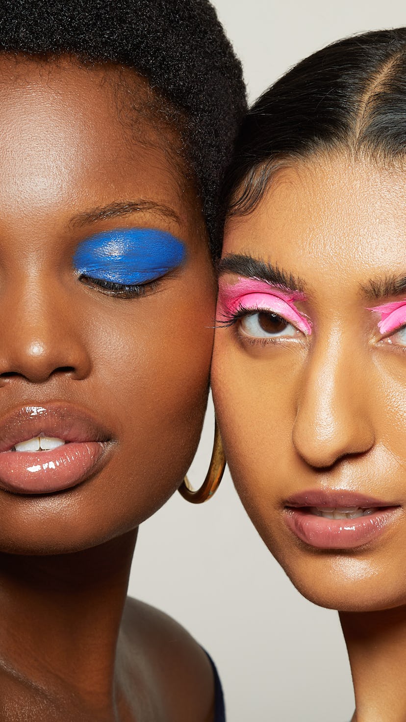 Two girls, one with blue eye shadow and the other with pink mono eyes shadow
