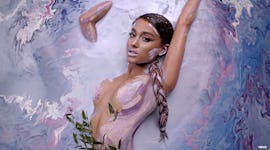 Ariana Grande wearing purple eyeshadow in "God is a Woman" music video.