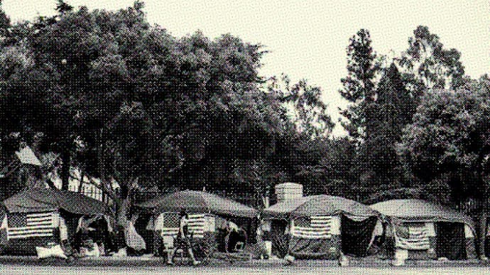 American flags are placed on every tent at a homeless encampment for veterans on San Vicente Bouleva...