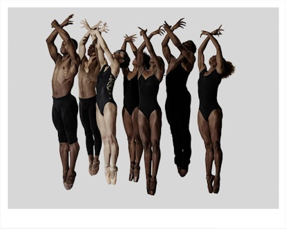 A photo of ballet dancers raising their arms by Rick Guest