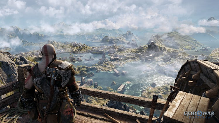 Kratos looking at lush landscape of mountains and trees