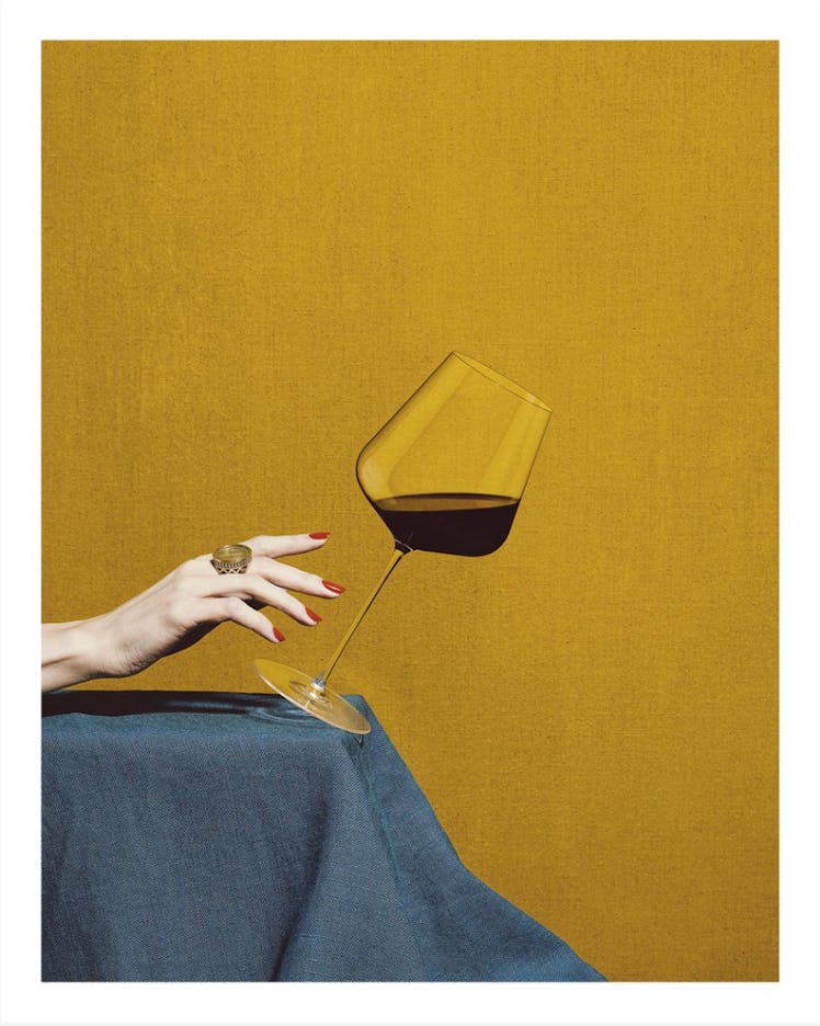 A photo of a glass of wine falling off a table by Jess Bonham and Anna Lomax
