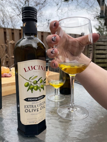 Supermarket olive oil in a standard glass
