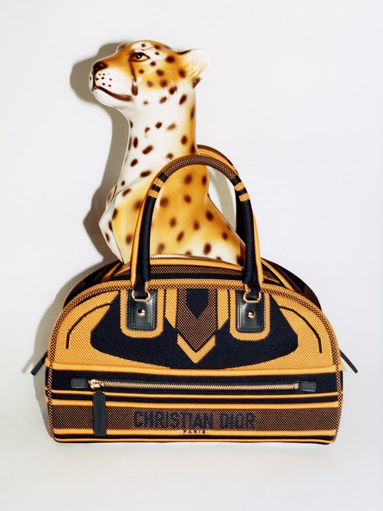 Bag with leopard statue.