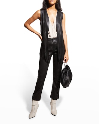 This LaMarque Sonia Fringed Leather Vest is an edgy addition to 90s jeans