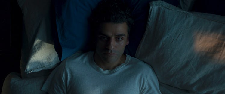 Oscar Isaac's Marc Spector lying in bed in Moon Knight