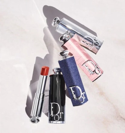 Dior Addict refillable cases on marble background