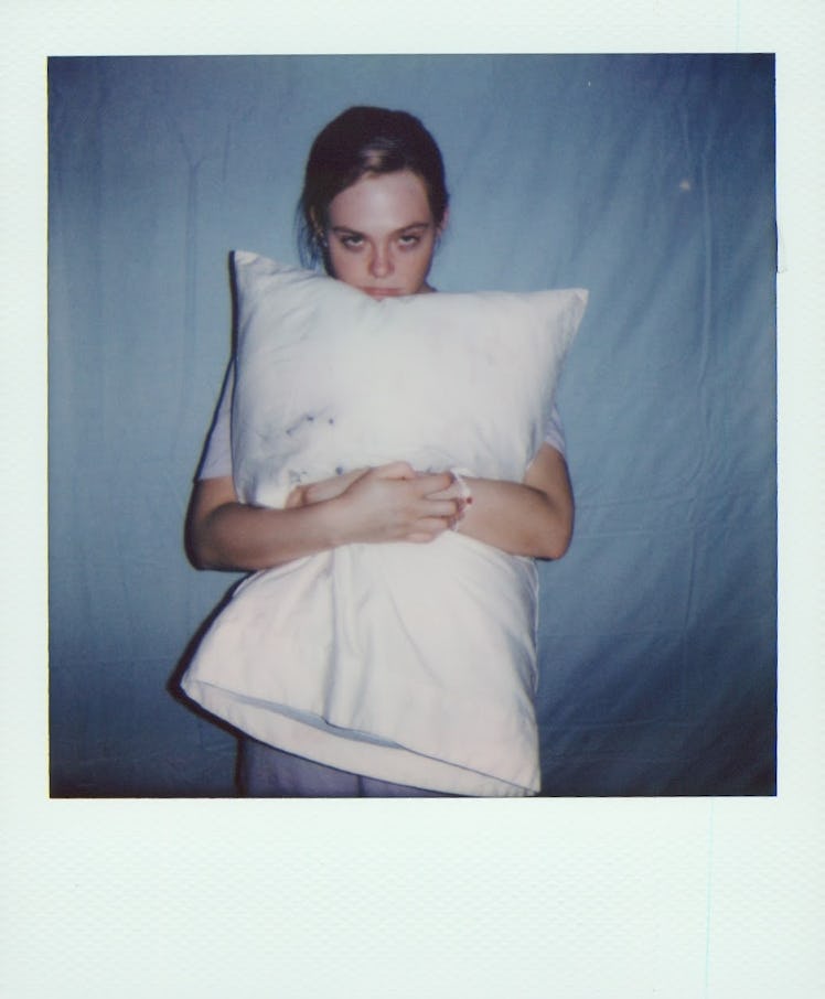 Elle Fanning with pillow