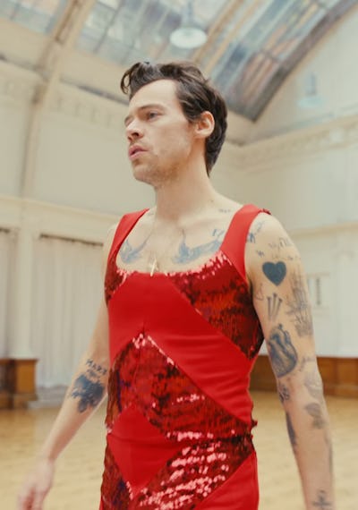 Harry Styles in his "As It Was" music video in a sequin, red jumpsuit.