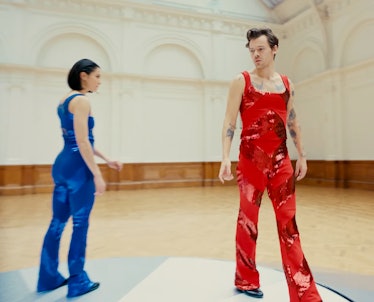 Harry Styles wearing a sequined red jumpsuit in his 'As It Was' music video