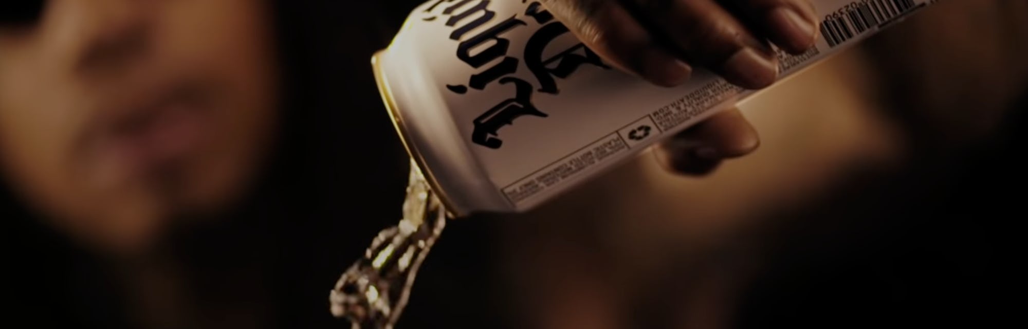 Wiz Khalifa pours a white can of Liquid Death mountain water