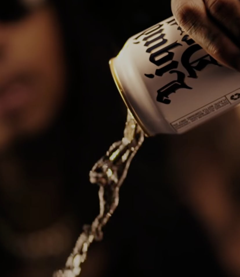 Wiz Khalifa pours a white can of Liquid Death mountain water