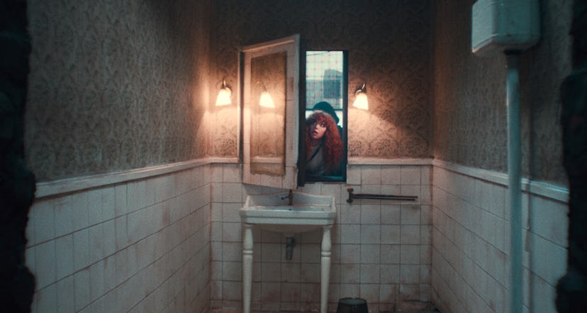 Nadia in Russian Doll crawling into a bathroom through a mirror 
