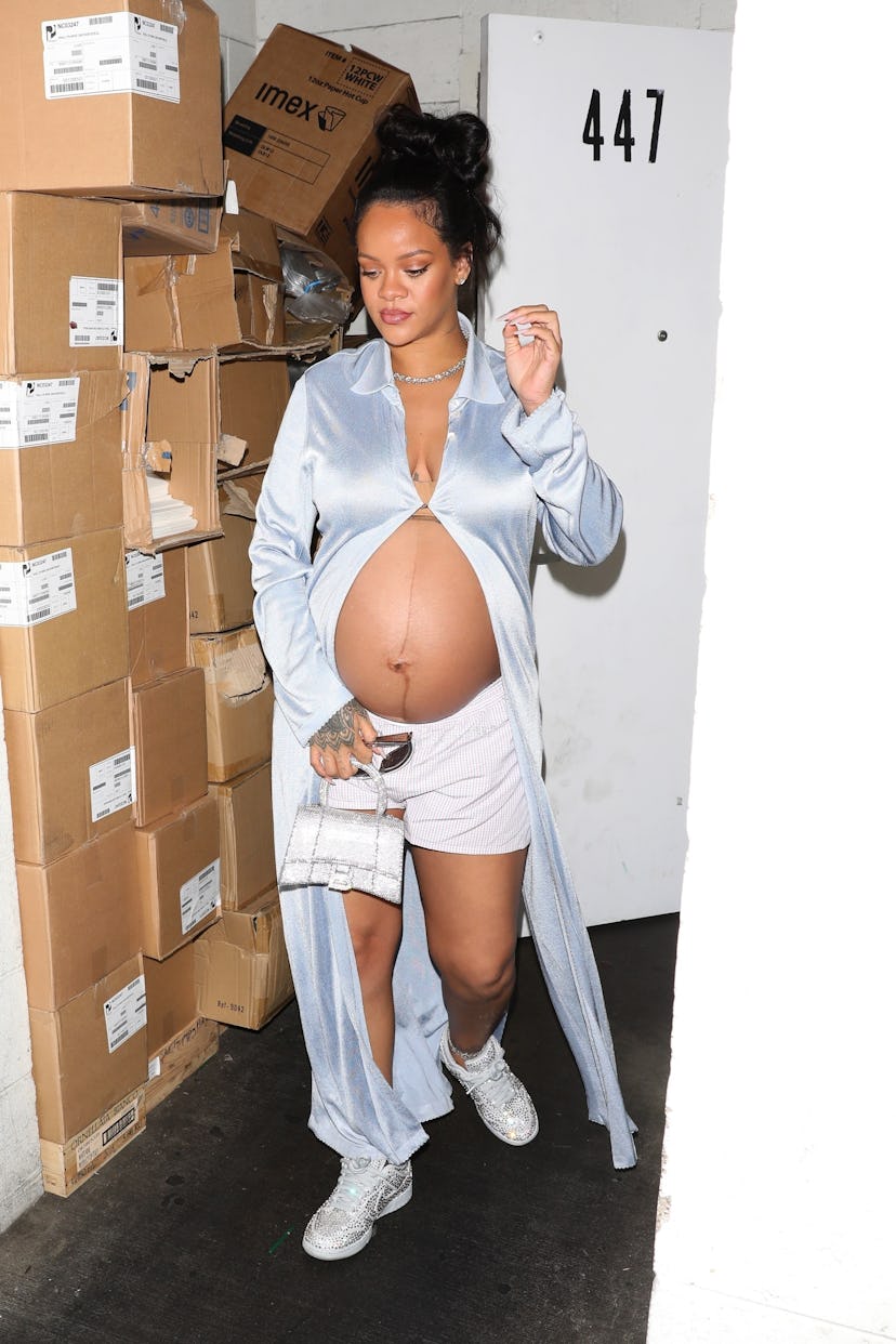 Rihanna shows off her burgeoning baby bump as she is seen leaving Wally's restaurant after having di...