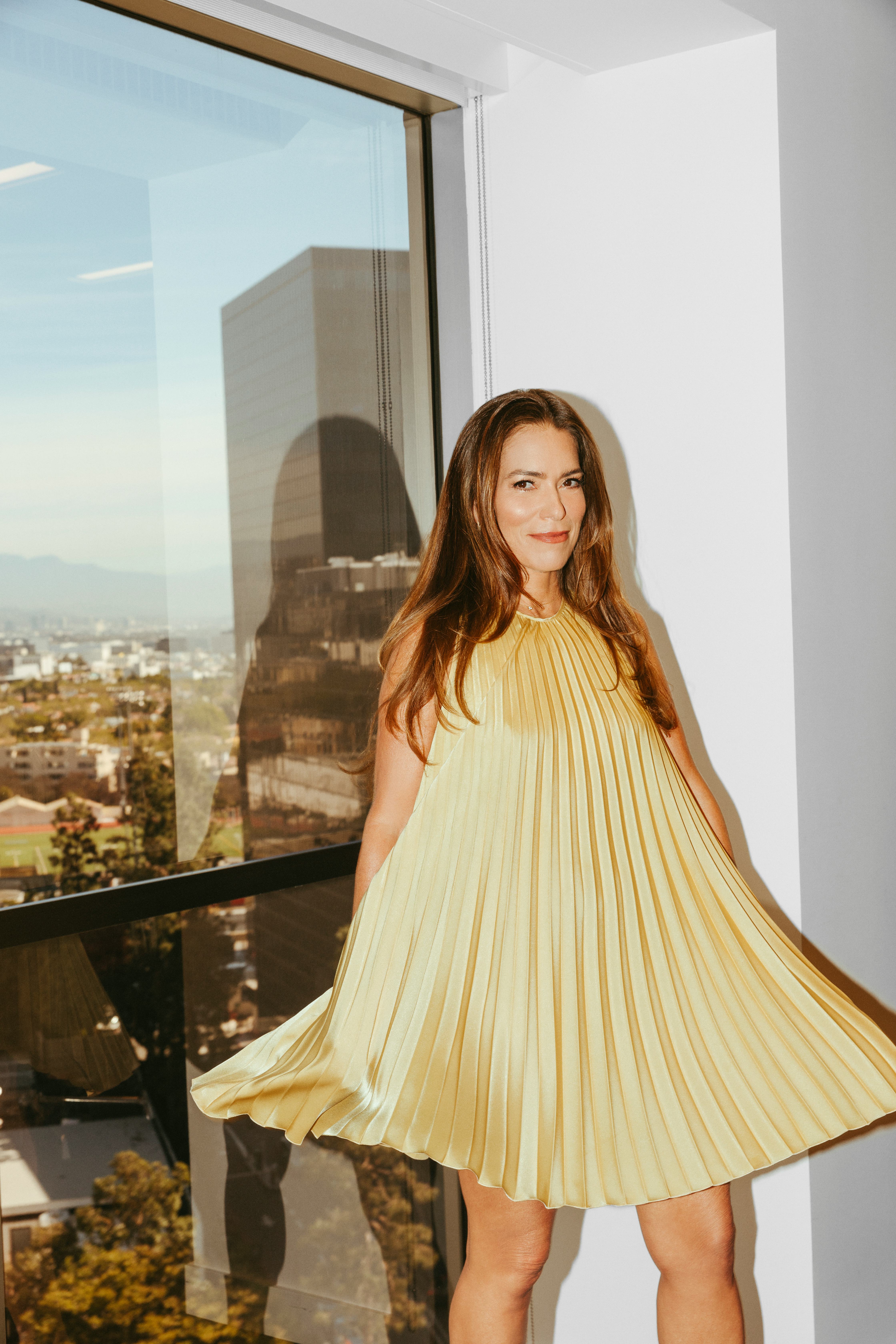 Laura Wasser&rsquo;s posing next to her office&rsquo;s window