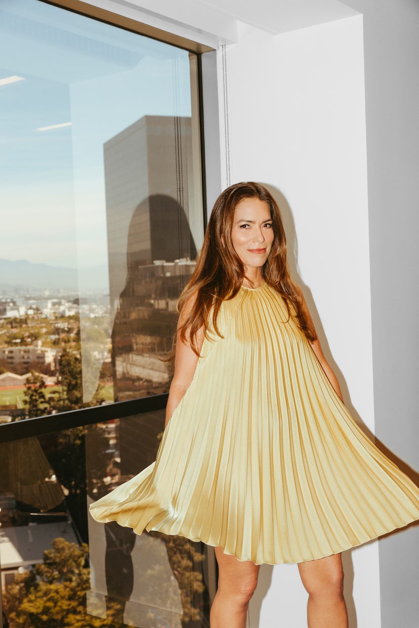 Laura Wasser’s posing next to her office’s window