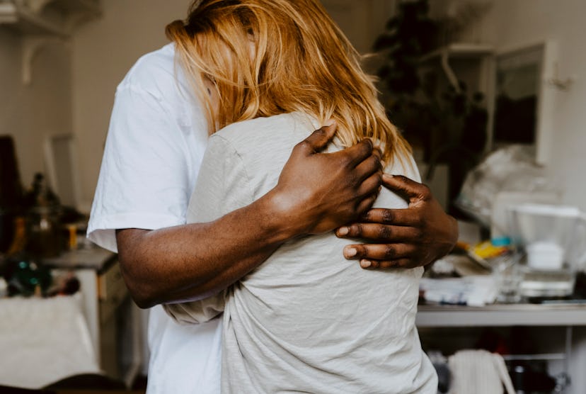 A man and woman embrace. American families face a mental health crisis. The pandemic has only made i...