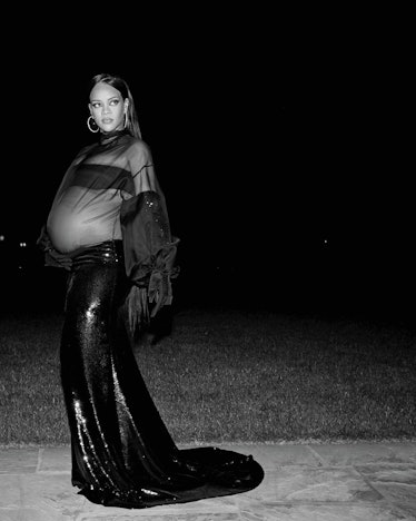A pregnant Rihanna wearing a sheer black dress