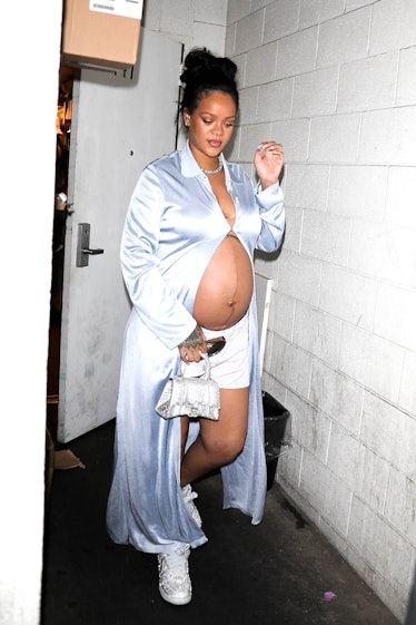 A pregnant Rihanna wearing a silky robe and Alexander Wang boxers
