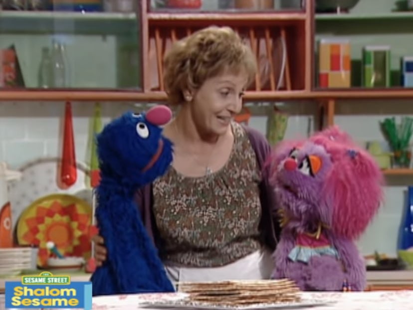 Grover listens as Shoshana explains Passover on Shalom Sesame