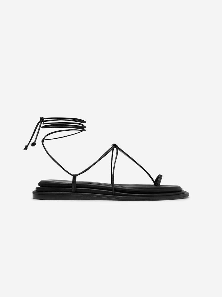 Tamara Mellon Solistice is a minimalist sandal.