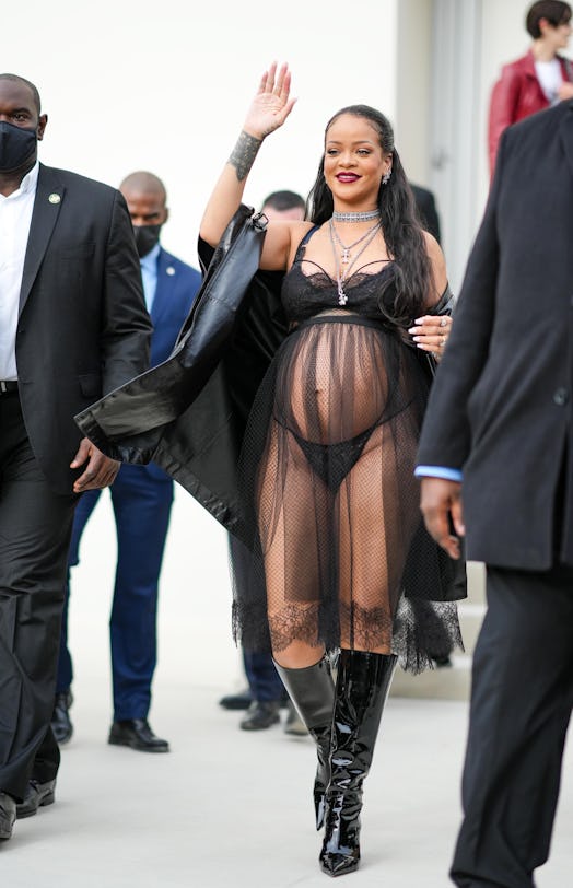 A pregnant Rihanna wearing a sheer black dress