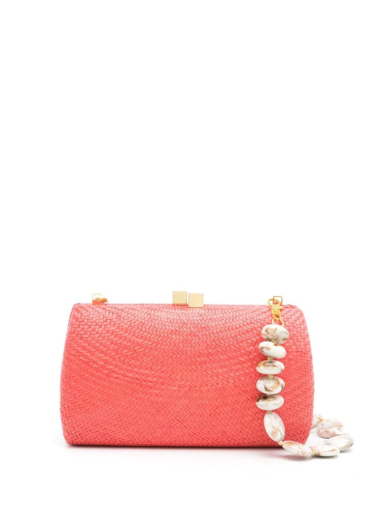 2022 vacation trends bright bags coral straw clutch with gemstone strap