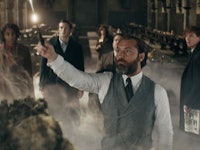 Jude Law holding a stick as Albus Dumbledore in "Fantastic Beasts 3"