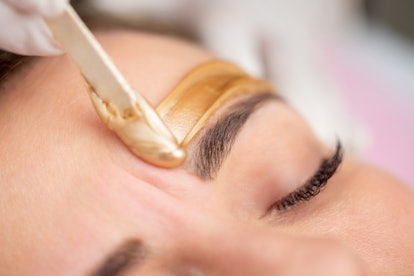 your brow hair should be at least 1/4 inch long before going in for a wax