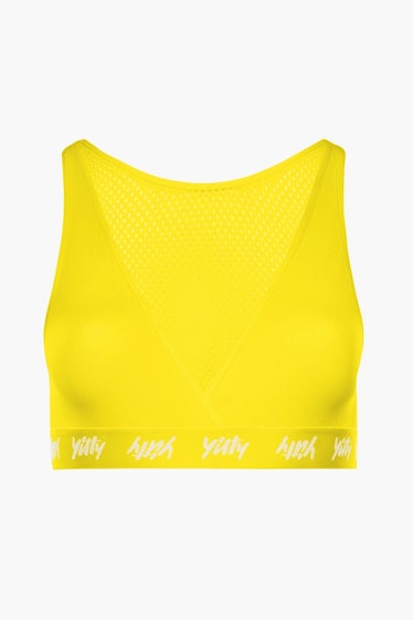 This yellow sports bra is from Lizzo's shapewear collection, YITTY.