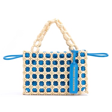 2022 vacation trends bright bags wood bead and bright blue bag