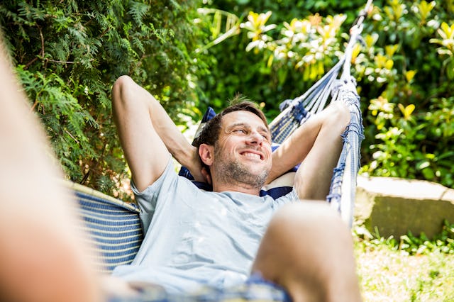 A yes-man enjoying his day on a rope swing bed