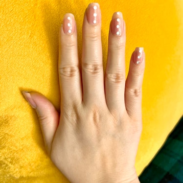 Deputy Editor Kaitlin Cubria wearing ManiMe's Never Ever Been Happier press-on nails.