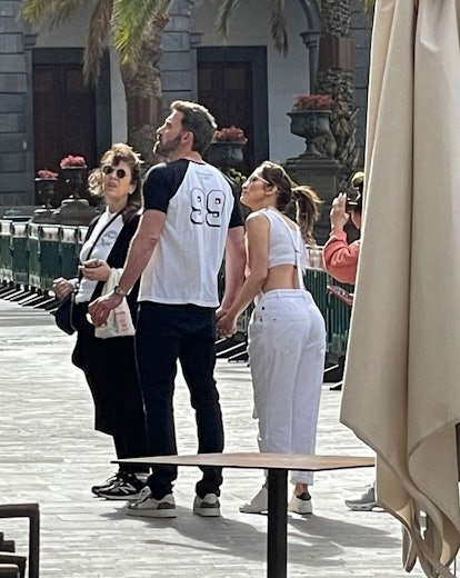 Jennifer Lopez wears white Brunello Cucinelli overalls.