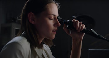 Kristen Stewart looking through a device in the first Crimes of the Future trailer