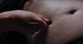 Kristen Stewart plugs a device into a person's abdomen in the first Crimes of the Future trailer