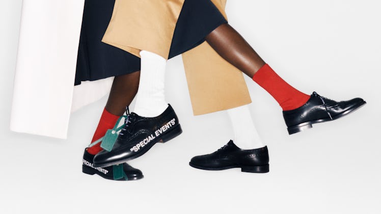 Off-White & Church’s collaboration shoes in black with white writing on them that reads "special eve...