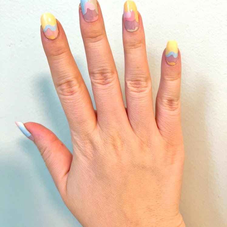 Deputy Editor Kaitlin Cubria wearing ManiMe's Ice Cream Dreams press-on nails.