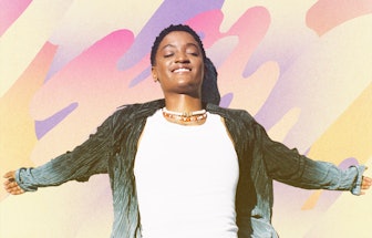 Syd on a multicolored background with her arms spread out and eyes closed, in a velvet collared shir...