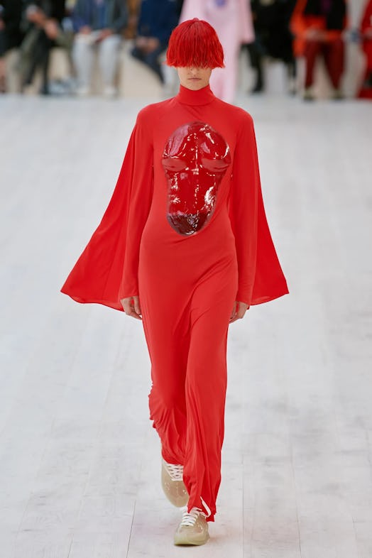 A model wearing red at the spring 2022 Loewe show