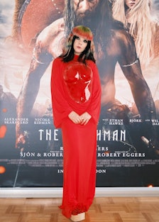 Björk wearing a red Loewe dress at the Reykjavík premiere of The Northman