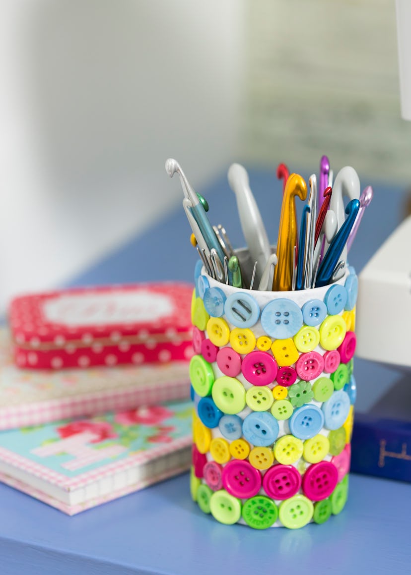 glued buttons on an empty can is a great DIY mother's day gift idea 