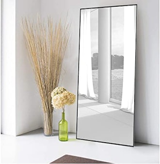 Full length framed mirror for opening up a room