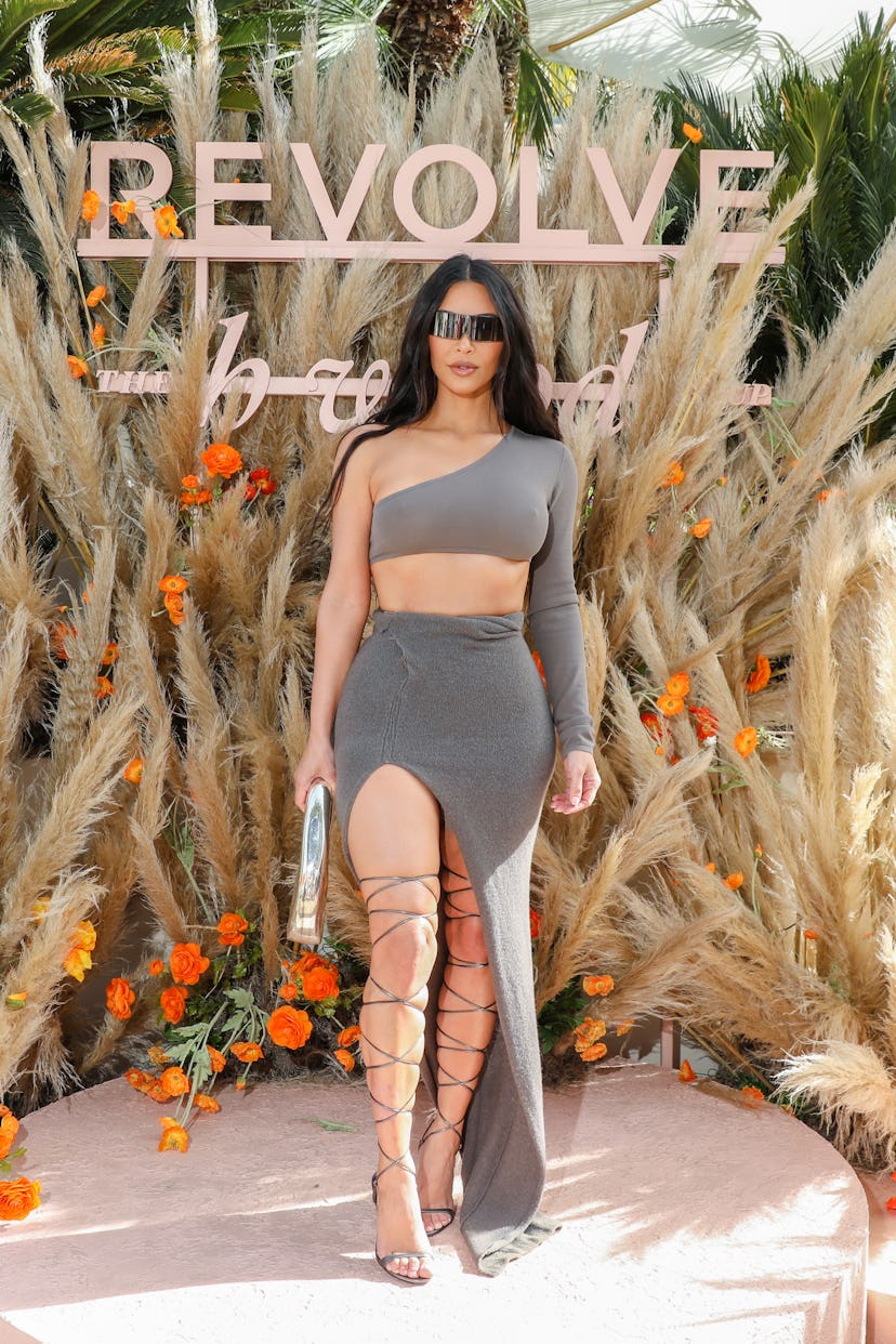 Kim Kardashian wearing large sunglasses and a Rick Owens ensemble at Revolve's Coachella party.